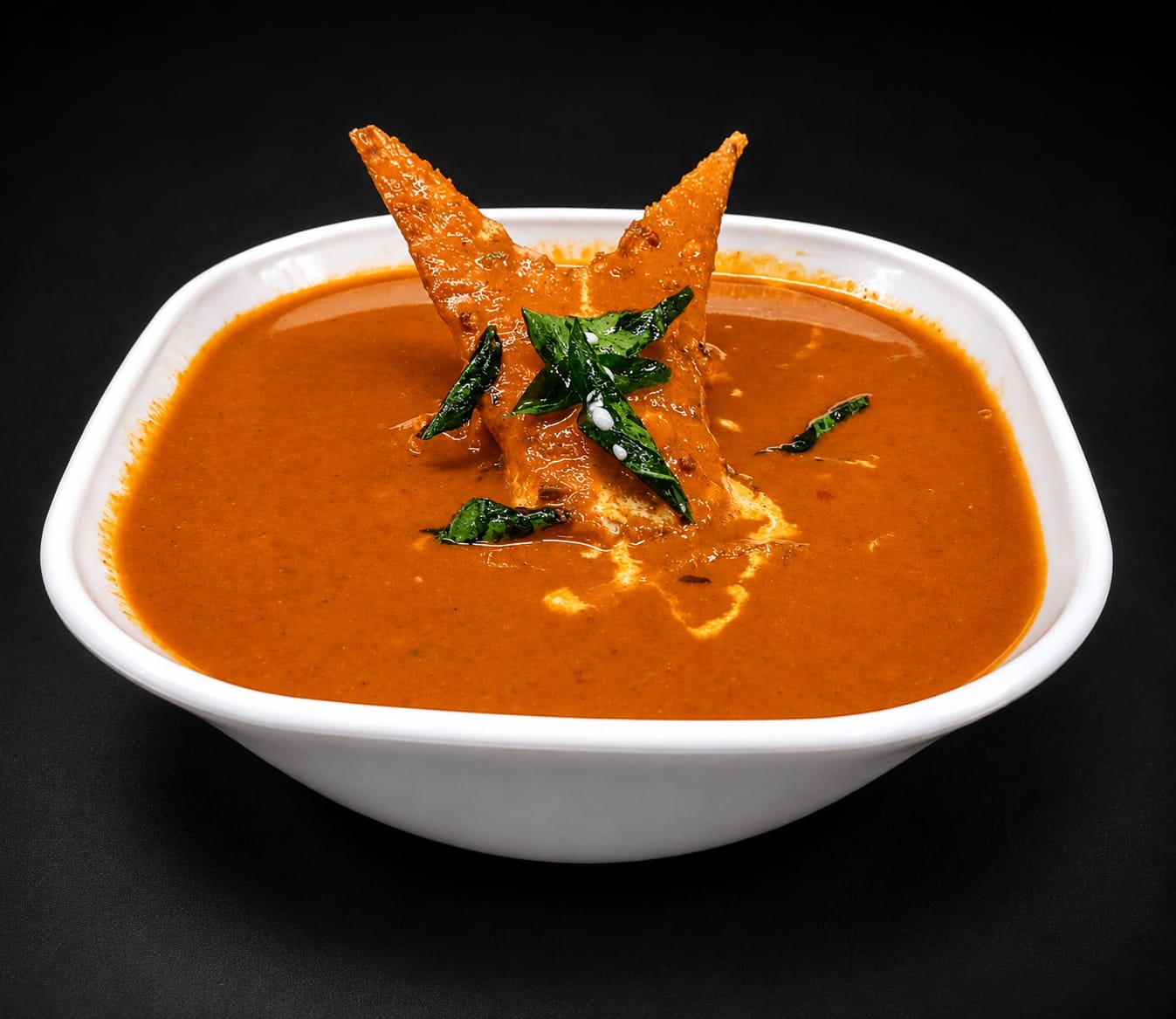 Rich aromatic Indian main course curry served in traditional copper kadhai with rice at Big Bull Cafe